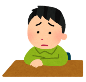 男の子が悩んでいる画像。